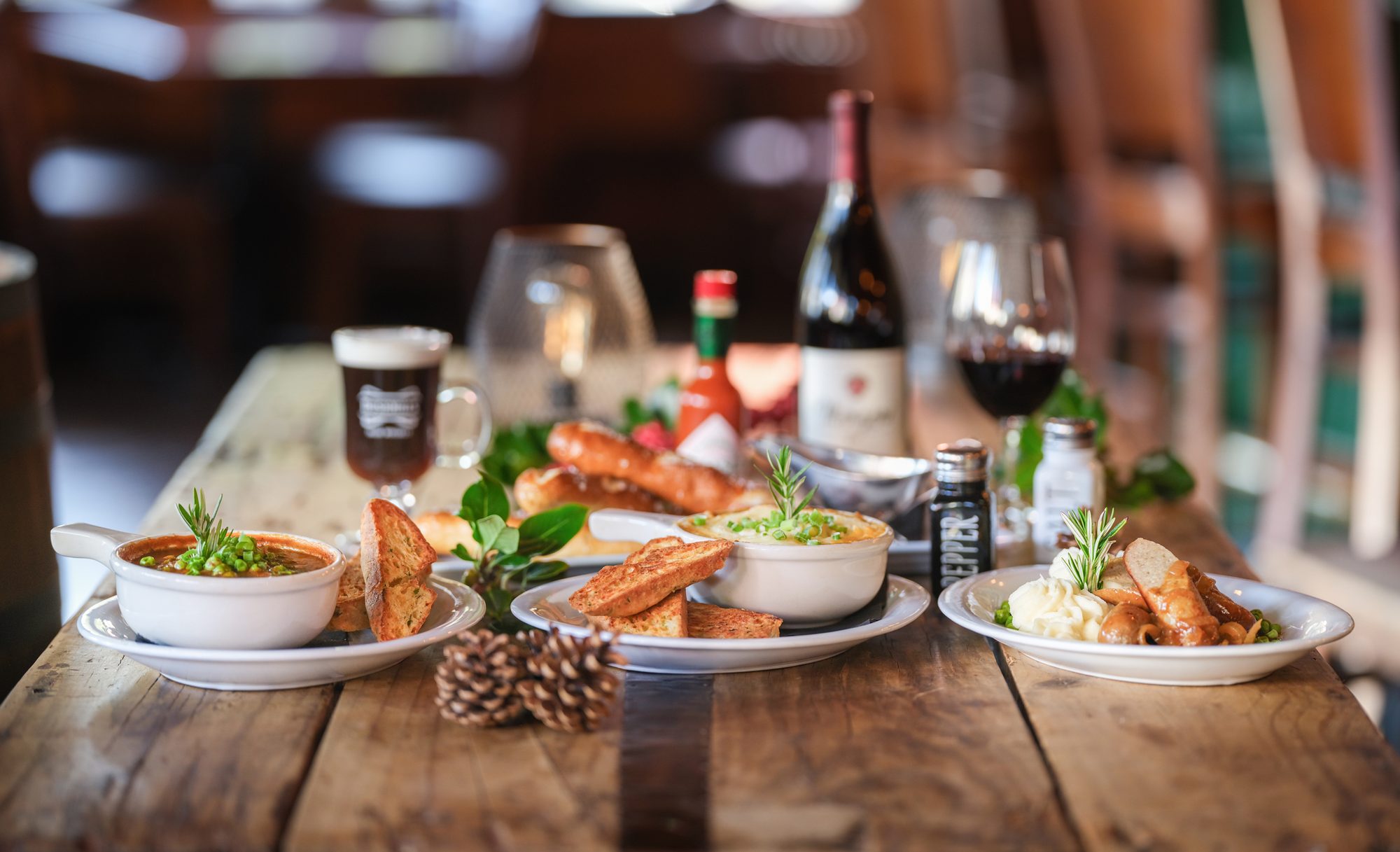 Irish stew, shepherd's pie, bangers and mash, an Irish coffee and red wine on a holiday table at O'Callaghan's Irish Pub in Carmel, CA